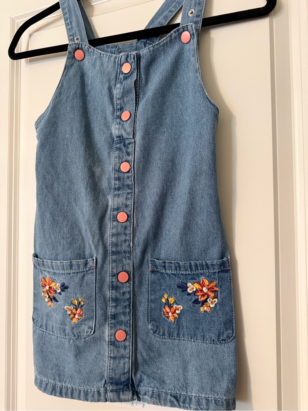 Girls Denim Pinafore Dress with Pink Buttons and Floral Embroidered Pockets - Picture 3 of 7